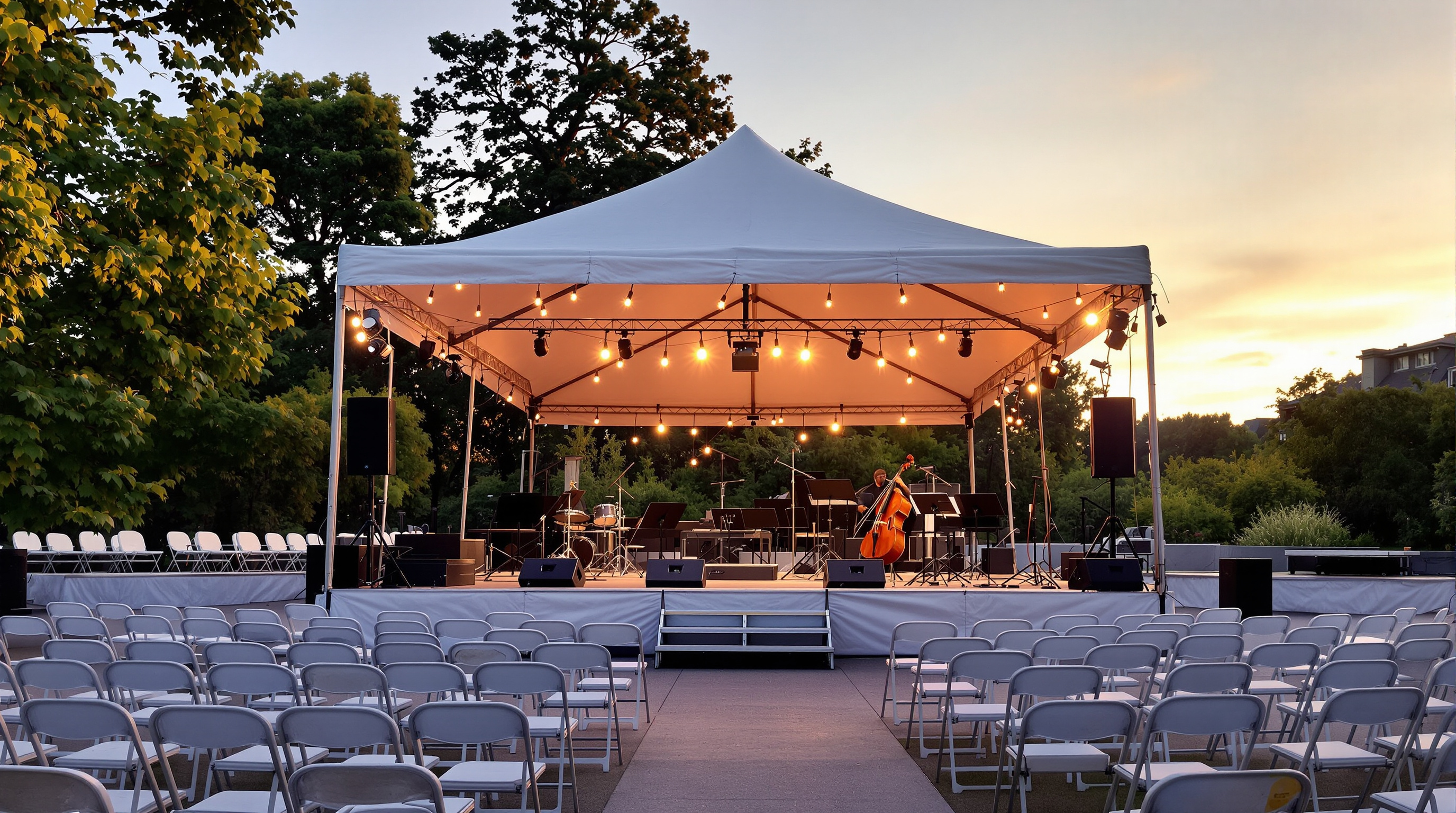 An outdoor summer chamber music festival stage at dusk